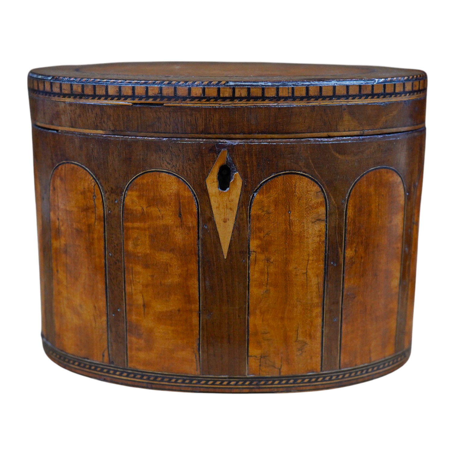 A George III oval satinwood and mahogany tea caddy, 15cm wide. Condition - poor